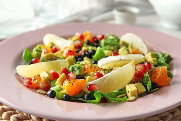 Plate with superfood salad on table