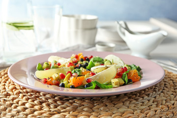 Plate with superfood salad on table