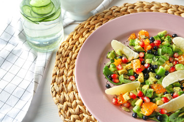 Plate with superfood salad on table