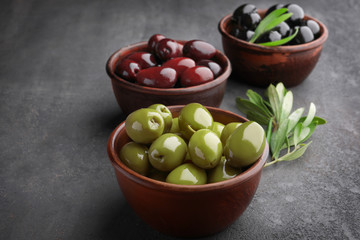 Bowl with different olives on kitchen table