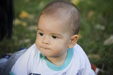 Cute baby boy spending a day in nature.