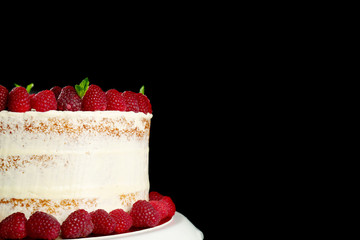 Delicious cake with raspberries on dark background