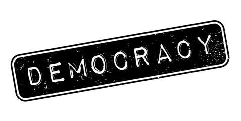 Fototapeta premium Democracy rubber stamp. Grunge design with dust scratches. Effects can be easily removed for a clean, crisp look. Color is easily changed.