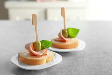 Foto op Plexiglas Delicious canapes for baby shower on plates © Africa Studio