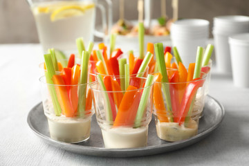Delicious appetizers for baby shower on metal plate