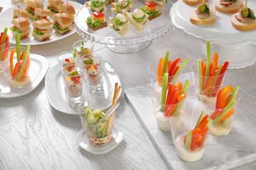 Banquet table with many different snacks for baby shower