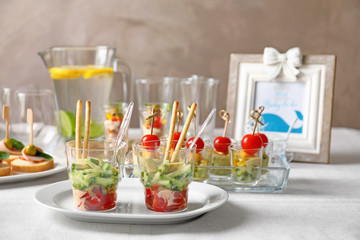 Banquet table with different snacks for baby shower