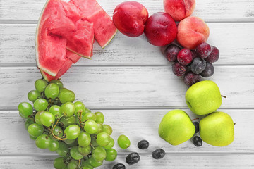 Naklejka na ściany i meble Composition with fresh fruits on wooden background