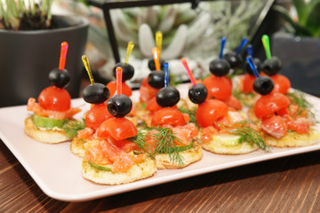 Canapes with smoked salmon and vegetables