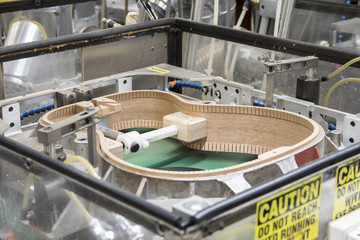 Guitar body under construction in factory