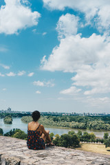 Girl is looking the view of Sava and Danube rivers, on Belgrade, Serbia.