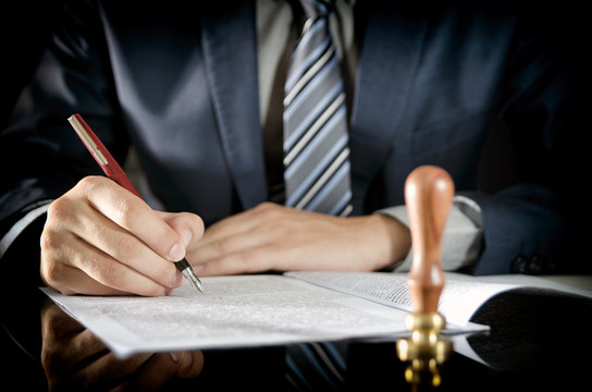 Lawyer signing contract, notary public, businessman agreement