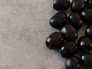 Glossy black olives. Macro. Copy space.