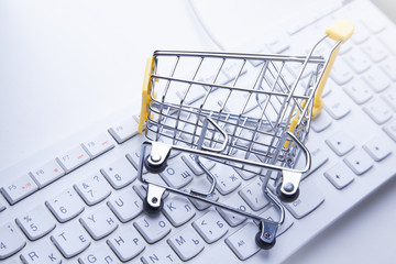 Online shopping trolley on keyboard