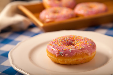 sprinkled doughnut on white plate