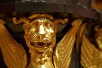 Antique bronze lion mask fixed to a wall