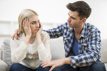 The man hug depressed woman