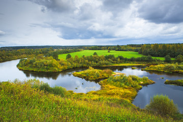 Fototapeta na wymiar Beautiful autumn rural scenery. A big river with Islands