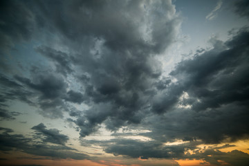 Blue/Gray/Orange sky overlay background with dramatic clouds at sunset