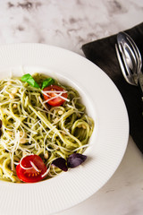 Spaghetti with homemade pesto. Pasta with pesto and herbs.