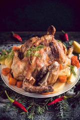 Whole roasted turkey with potatoes served on the plate,selective focus