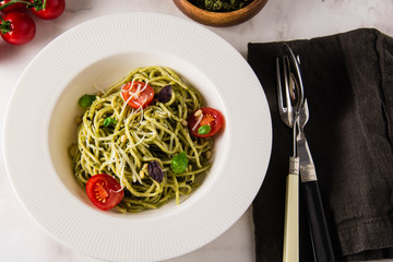 Spaghetti with homemade pesto. Pasta with pesto and herbs.