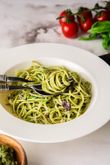Spaghetti with homemade pesto. Pasta with pesto and herbs.