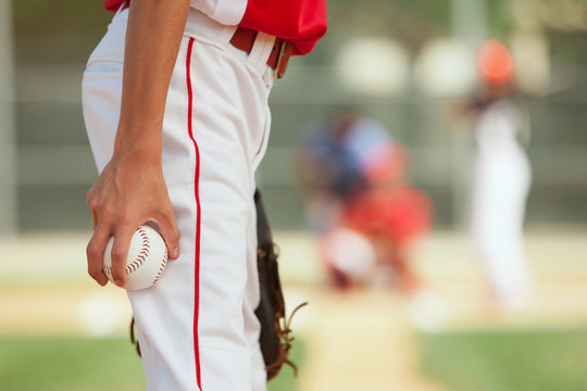 Pitcher about to throw a baseball