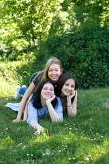 Fototapeta premium three girls having fun outdoors. women's friendship