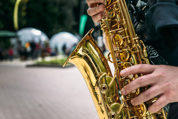 Hands of saxophone player close-up - obrazy, fototapety, plakaty