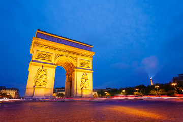 Fototapeta na wymiar Illuminated Arc de Triomphe at night, Paris
