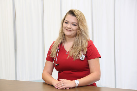 Young attractive female healthcare worker, woman nurse