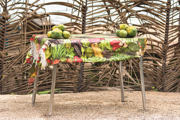 Exotic fruits sold on the road, papayes on a market stall, street hawker in French Polynesia,...