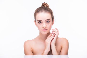 Naklejka premium Beautiful face of young woman with clean fresh skin.
