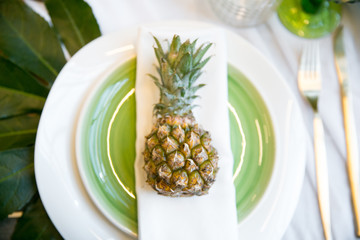 plate decorated with a pineapple and decor, green and white colour