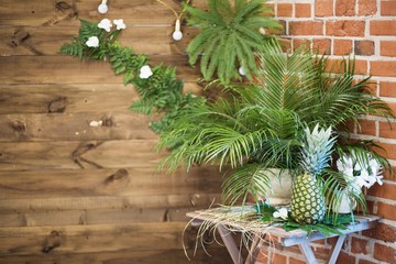 pinapple on the table decorated with flowers