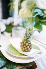plate decorated with a pineapple and decor, green and white colour