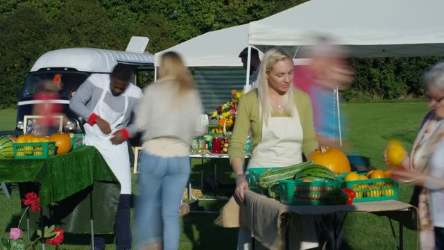  Time lapse friendly stall holders selling fresh produce to customers