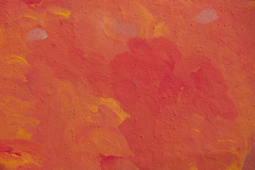 Orange wall with plaster pattern background