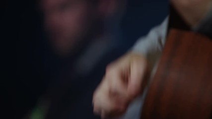  Close up guitarist playing live on stage at music event