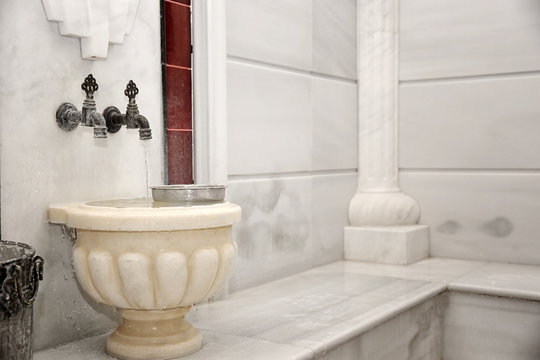 Traditional marble kurna with bowl in turkish hammam