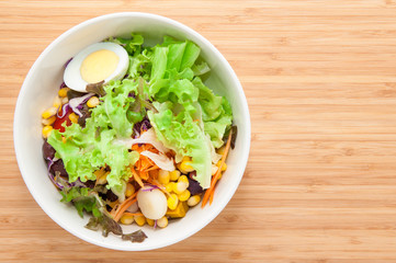 Fresh healthy salad on table.