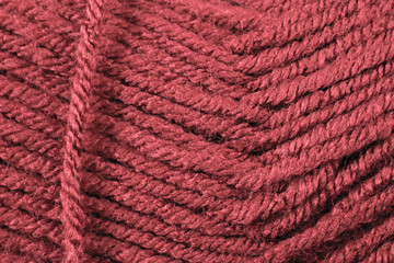 A super close up image of scarlet yarn 