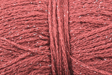 A super close up image of crimson yarn 