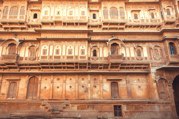 Naklejka premium Facade of historical indian house with ancient design of walls and balconies, Rajasthan of India