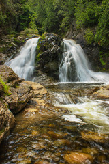two waterfalls in the forest