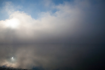 Morning on the river early morning reeds mist fog and water surface on the river