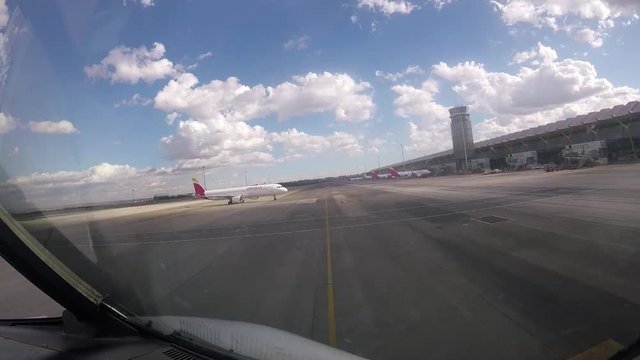 time lapse.run down the runway of a commercial airplane and take off in madrid.cabin view