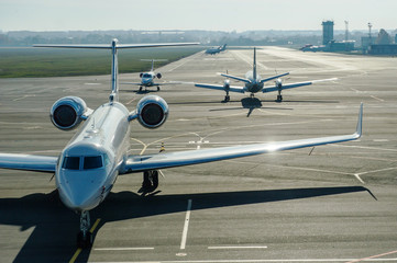 Private jet planes on the landing line in the morning time.