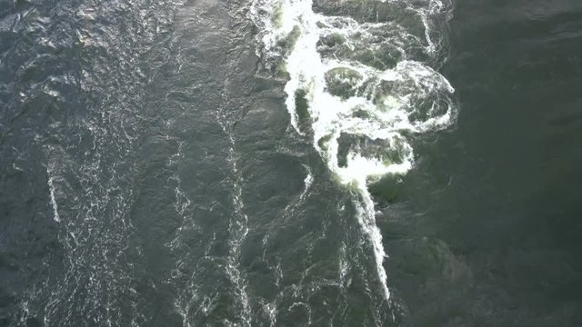 Back view of the sea washing from a speedboat
